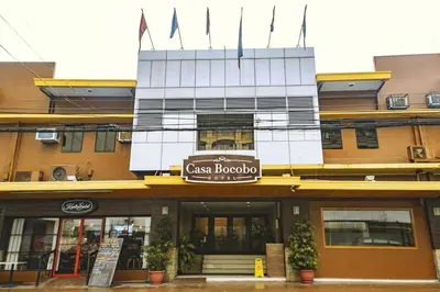 a building with a sign that reads cafe bouquet at Casa Bocobo Hotel in Manila