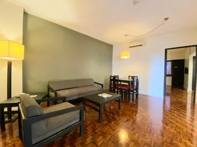 a living room with a couch and a table at Copacabana Apartment Hotel in Manila