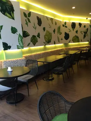 a row of tables and chairs in a restaurant at El Cielito Inn - Sta. Rosa in Santa Rosa