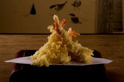 a piece of food on a plate on a table at Herald Suites in Manila