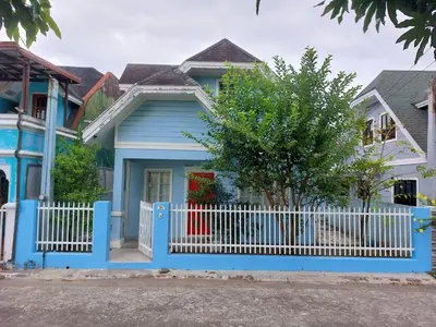 a blue house with a white fence at Homestay at 24 Laguna Bel-Air by Red Door House Rental in Santa Rosa
