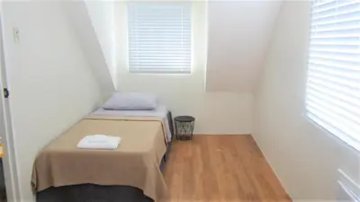 a small room with a bed and a window at Homestay at 24 Laguna Bel-Air by Red Door House Rental in Santa Rosa