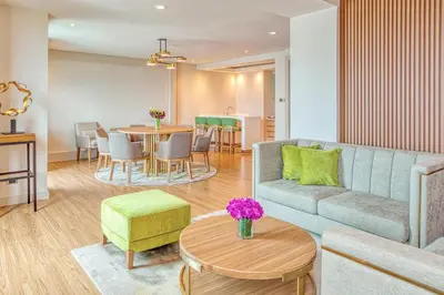 a living room with a couch and a table at Eastwood Richmonde Hotel Quezon City in Manila