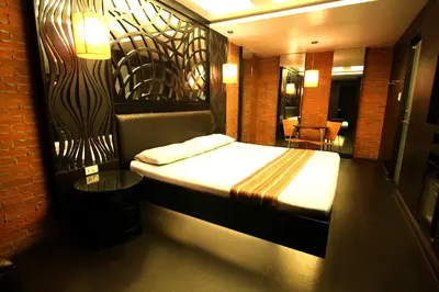a hotel room with a bed in a room at Hotel Ava Malate in Manila