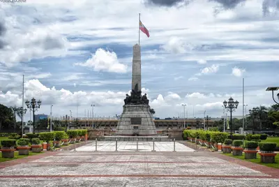 a monument with a flag on top of it at Riviera Mansion Hotel in Manila