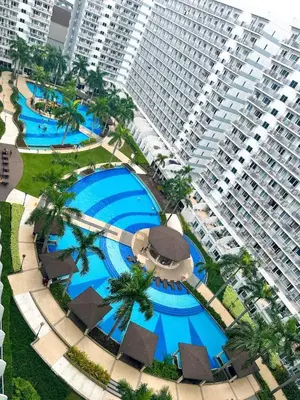 an aerial view of a large apartment building and a pool at BEST Q CONDO w/ Great View in Manila