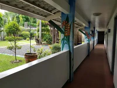 an empty corridor of a school building with a walkway at Riverview Resort and Conference Center in Calamba