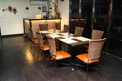 a dining room with a table and chairs at Riverview Resort and Conference Center in Calamba