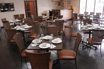 a dining room filled with tables and chairs at Riverview Resort and Conference Center in Calamba