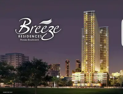 a sign for a hotel with a city skyline at SMDC Breeze Residences by Dominga in Manila
