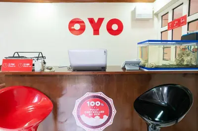 a counter with a fish tank and a sign at Conrado's Apartelle in Manila