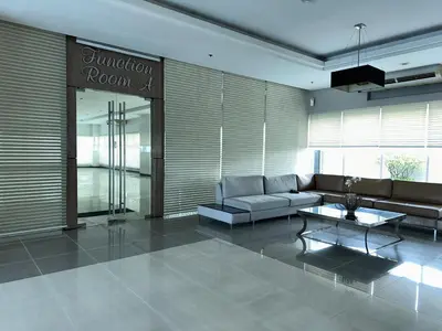 a living room with a couch and a table at JR Studio Luxe 1824 at Princeton Residences in Manila