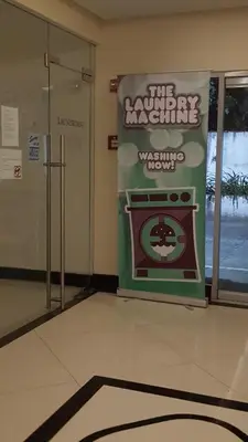a room with a sign for a microwave oven at Morgan Suites in Manila