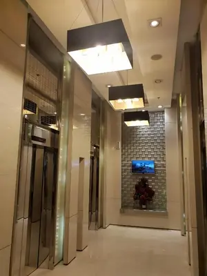 a hallway of a building with a tile wall at Your HOME @ Princeton Residences, New Manila in Manila