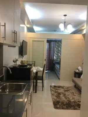 a kitchen and living room with a dining room at Reese @ Sea Residences Manila in Manila