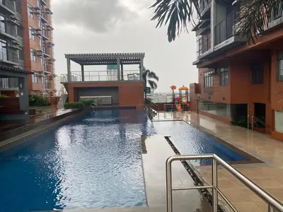 a swimming pool in the middle of a building at Penthouse suite at Porto Vita Towers in Cubao Quezon City in Manila