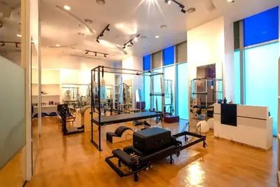 a room with a gym with a tv and equipment at The Alpha Suites in Manila