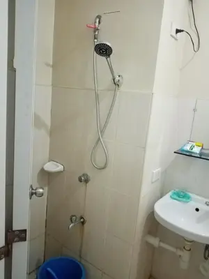 a bathroom with a shower and a sink at Spacious Studio unit beside Enchanted Kingdom at Santa Rosa City Laguna in Santa Rosa