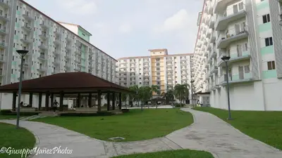 a gazebo in a park next to some buildings at Genesis unit SMDC Fields in Manila