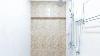 a bathroom with a shower with a glass door at RedDoorz near NAIA Terminal 1 in Manila
