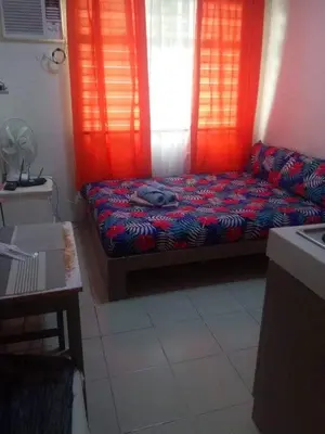 a living room with a couch and a window at Urban Deca Tower @ Graceysplace Unit 4 Mandaluyong in Manila