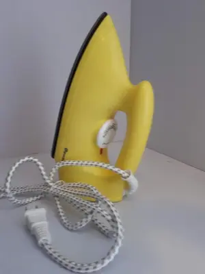 a yellow telephone with a chain around it at 1BR with Balcony Overlooking Pool Chateau Elysee Near NAIA in Manila