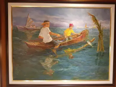 a painting of two men in a boat in the water at Stay Amare Residences Malate in Manila
