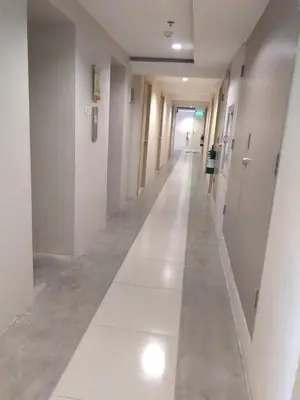 a hallway of a hospital with white walls and a long aisle at Superb Edsa Cheap Hotel @ Graceysplace Unit 2 in Manila