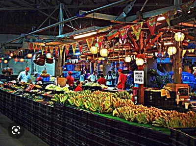 a market with many bunches of bananas on display at Condotel Type in Manila