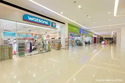 an empty shopping mall with a wissos sign in the middle at Condotel @JAZZ Residences in Manila