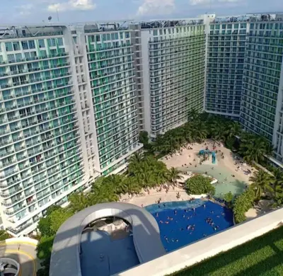 an aerial view of a resort with tall buildings at Adam'sCrib Apartment 2BR by Azure Residences Near Manila International Airport in Manila