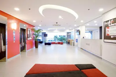 an office hallway with a red and white lobby at Red Planet Makati Avenue Manila in Manila