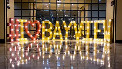 a sign that says baumite in front of a building at Bayview Park Hotel Manila in Manila