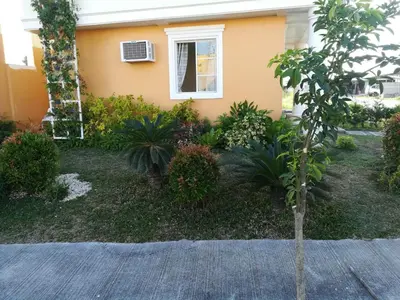 a house with a small tree in the front yard at Julzhome PH Properties by Juliet AfricaPervaze in Santa Rosa