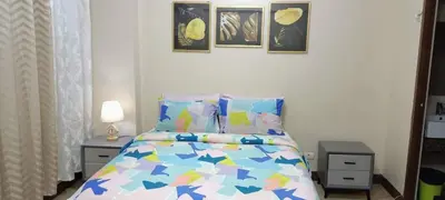a bedroom with a bed with blue stars on it at Two Palm Tree Villas close to Manila Airport - Terminal 3 in Manila