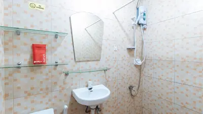 a bathroom with a sink and a mirror at L Mansion 2 Palanan Makati City in Manila