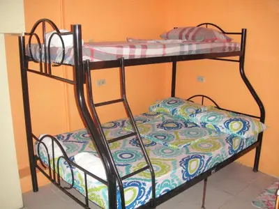 a couple of bunk beds in a room at JCP Room Rentals in Manila