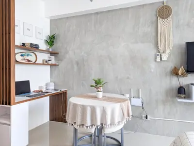 a dining room with a table and a laptop at Studio Condo Manila by the Bay Roxas Blvd near US Embassy in Manila