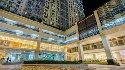 a large building with tall buildings in the background at Makati Condo Edsa MRT Magallanes Station Chino Roces Ave cor EDSA IT Hub ONE Ayala Alphaland WiFi by 24K Residences in Manila
