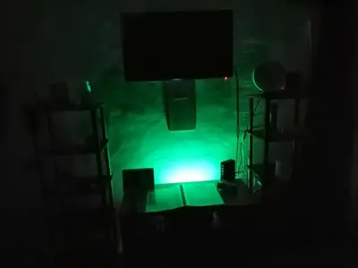 a room with a green light in the dark at Condo Near NAIA Airport T 1,2,3&4 v4 in Manila