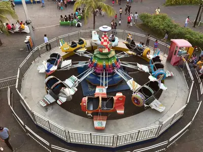 a merry go round at a amusement park at Best Value Q Condo1439 in Manila