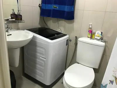 a bathroom with a white toilet and a sink at Best Value Q Condo1439 in Manila