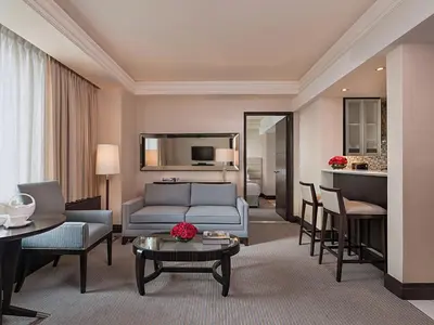 a living room with a couch and a table at Quest Plus Filinvest City Manila in Manila