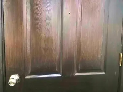 a wooden door with a toilet paper dispenser on it at Condo Transient Near NAIA Airport T1234 with Unlimited WIFI v1 in Manila
