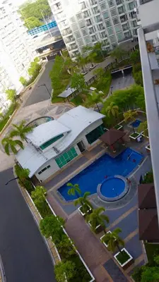 an overhead view of a building with a swimming pool at Ameer Condotel @ Parkside Villa in Manila