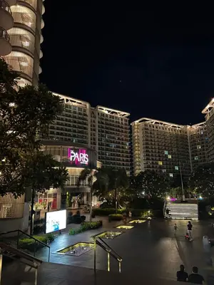 a night view of a city with tall buildings at AZURE URBAN RESORT RESIDENCE R&C - Parañaque in Manila