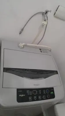 a close up of a machine with a cord on it at 1BR Grace Residences w/ Internet- near BGC/McKinley in Manila
