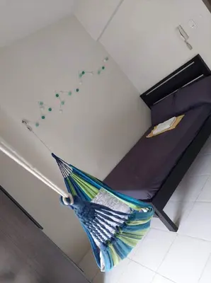 a room with a bed in a room with at Cozy Studio @ One Capitol Condo 2nd St. Kapitolyo in Manila