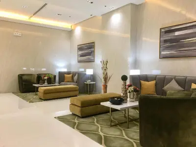 a lobby with two couches and a table at Condo 101 Newport in Manila