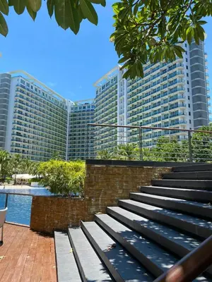 a set of stairs in front of a large building at Azure Urban Resort Residences, Condo, Manila Airport, Wave-Pool, Tropical Vibe in Manila